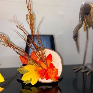 Handmade fall decor on small round wood